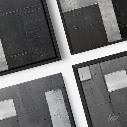 composition of abstract framed artwork in shades of black, gray, and silver with a thin black frame