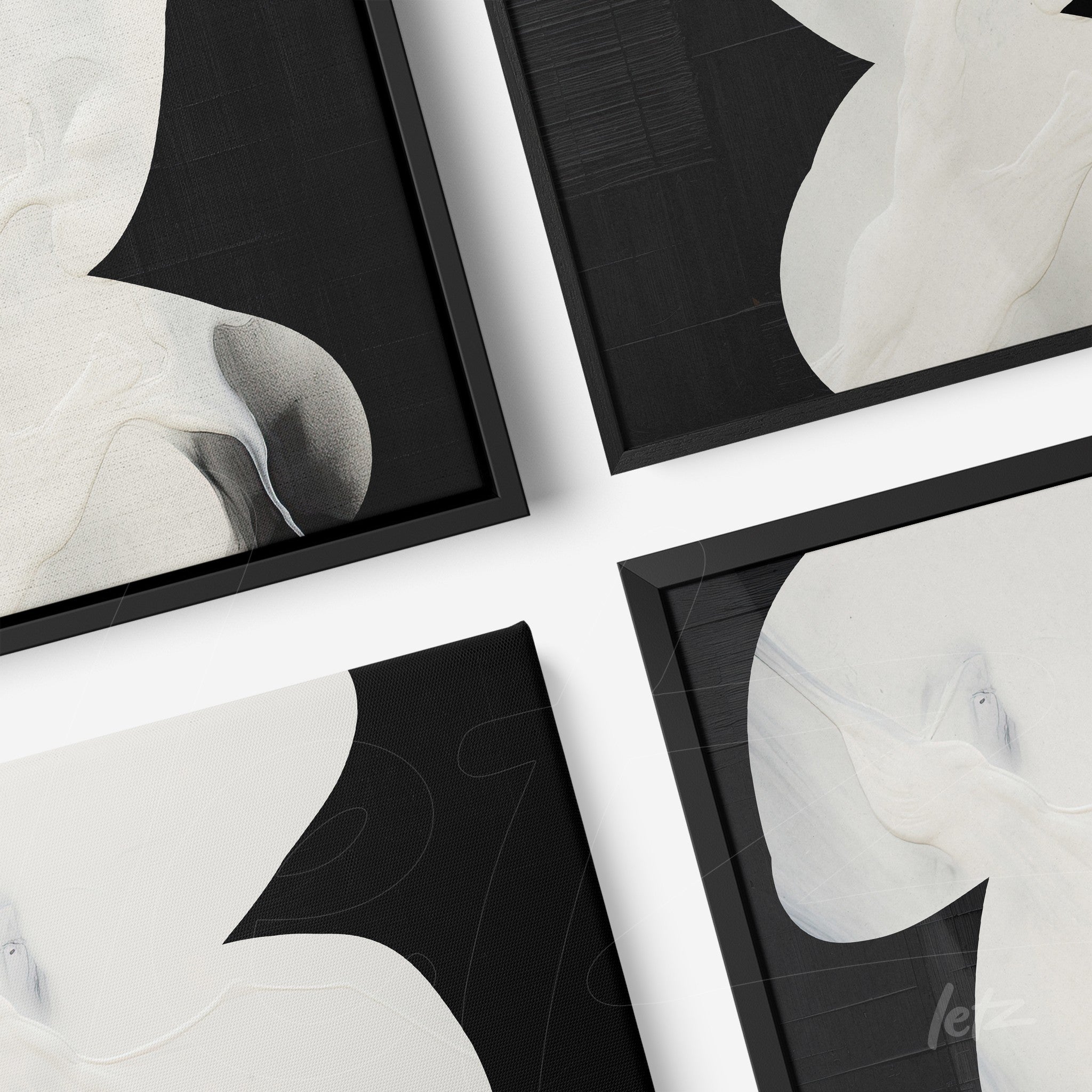 collection of canvas art featuring abstract designs in black background with white elements, black frame