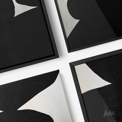 composition of decorative wall art featuring abstract black and white shapes with thin black frames