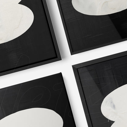 composition of abstract wall art featuring white shapes on black background, thin black frames
