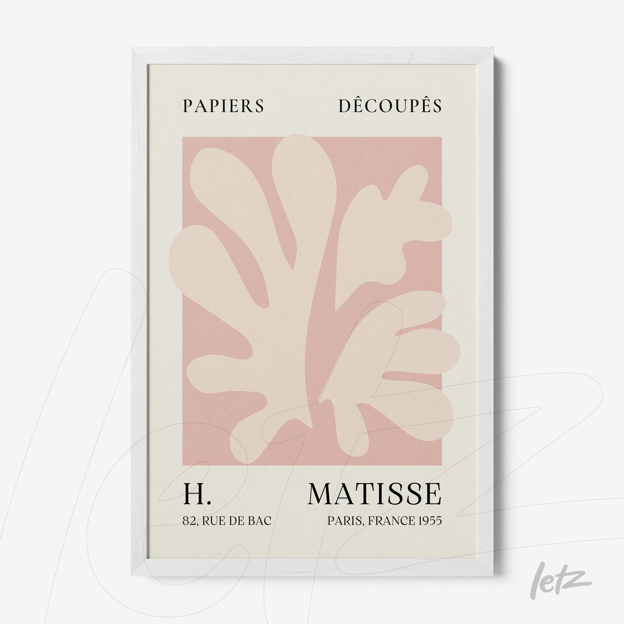 framed wall art featuring paper cut-out design in light pink tones with classic typography against a cream background