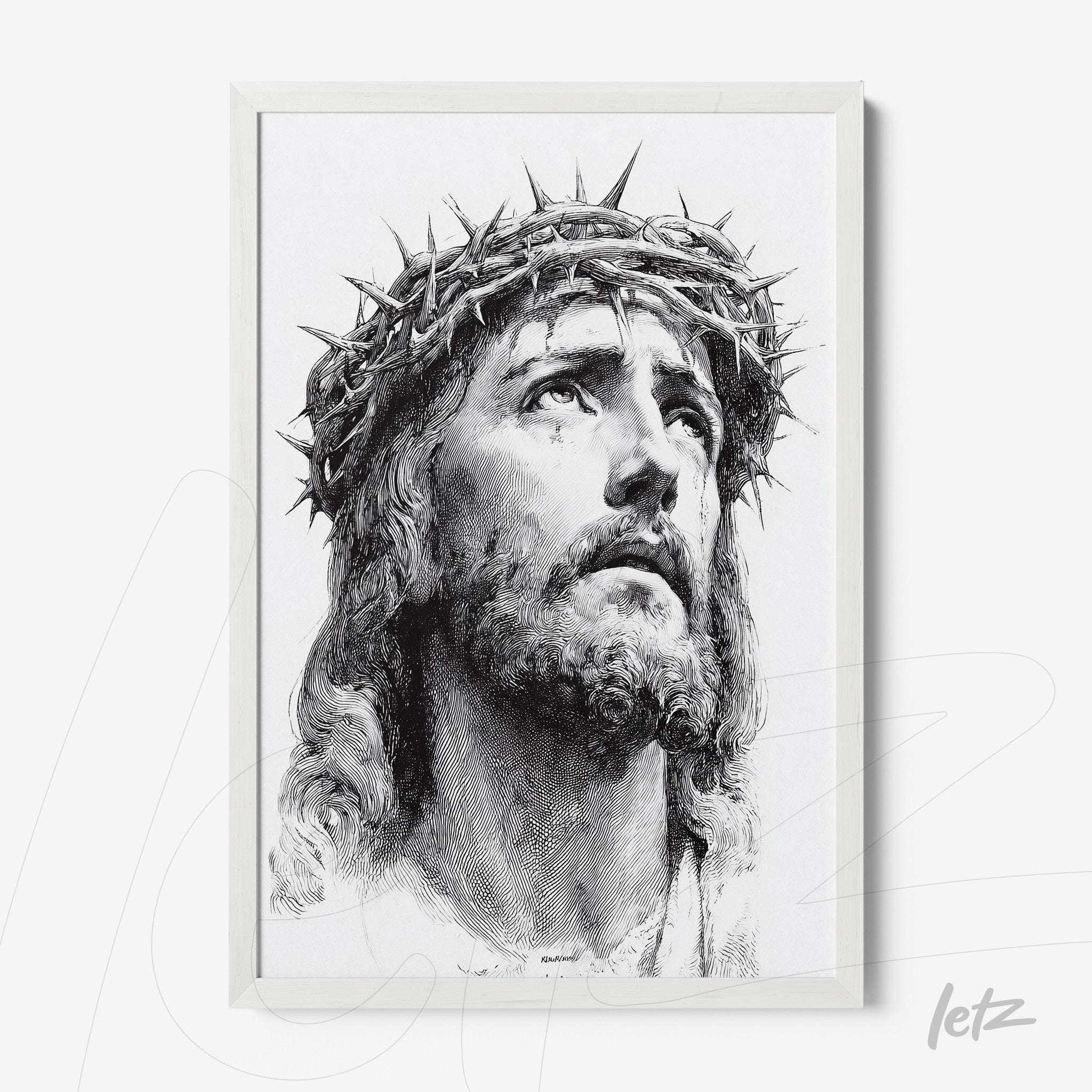 framed wall art in white featuring a black and white portrait of Jesus Christ wearing a crown of thorns