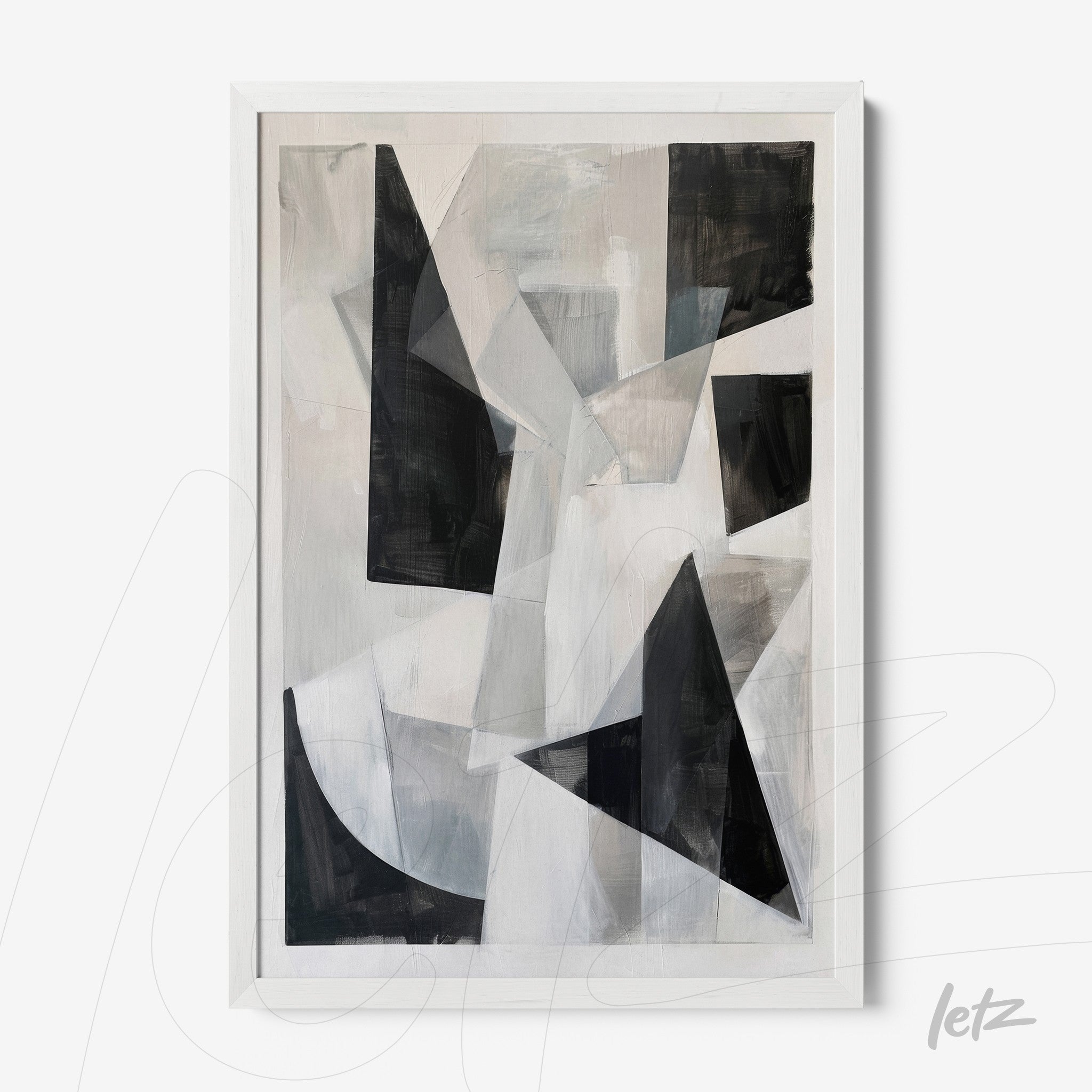 abstract wall art in shades of black, white, and gray with a white frame