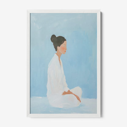 framed artwork depicting a woman in meditation against a blue background with white frame