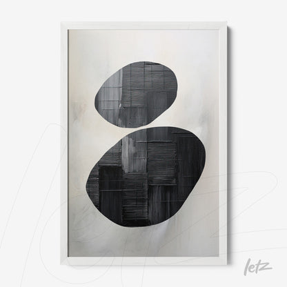 abstract wall art featuring black oval shapes on a light background in a white frame
