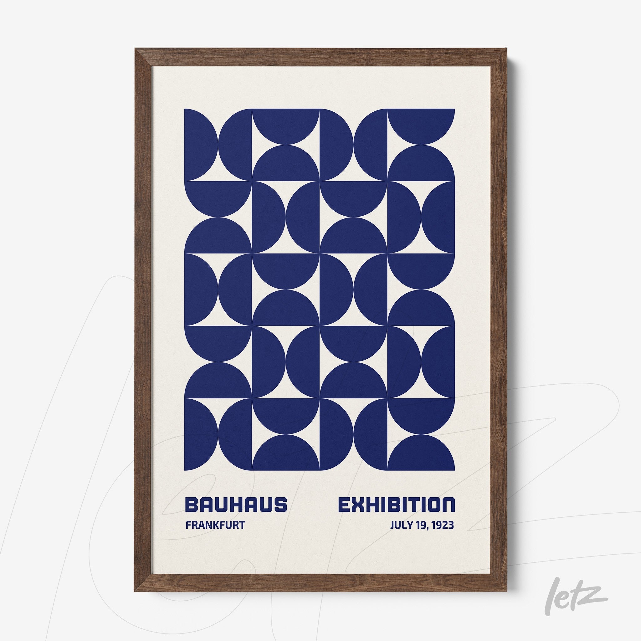 framed geometric wall art in blue bauhaus style with dark wooden frame