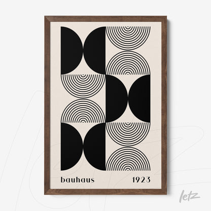 canvas art with black and white geometric Bauhaus style design in dark wood frame