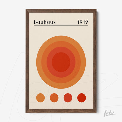 poster featuring concentric circles in shades of orange and brown with Bauhaus style, framed in dark wood