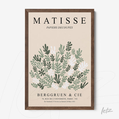 framed wall art featuring modernist style green leaves design with dark wood frame