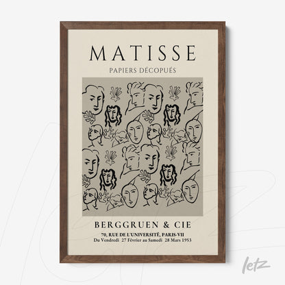 framed artwork featuring minimalistic line art of faces on a neutral background with a dark wooden frame