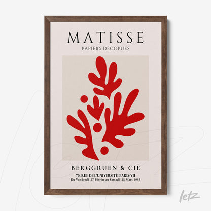 framed wall art of Matisse featuring abstract red shapes on a light background with dark wooden frame