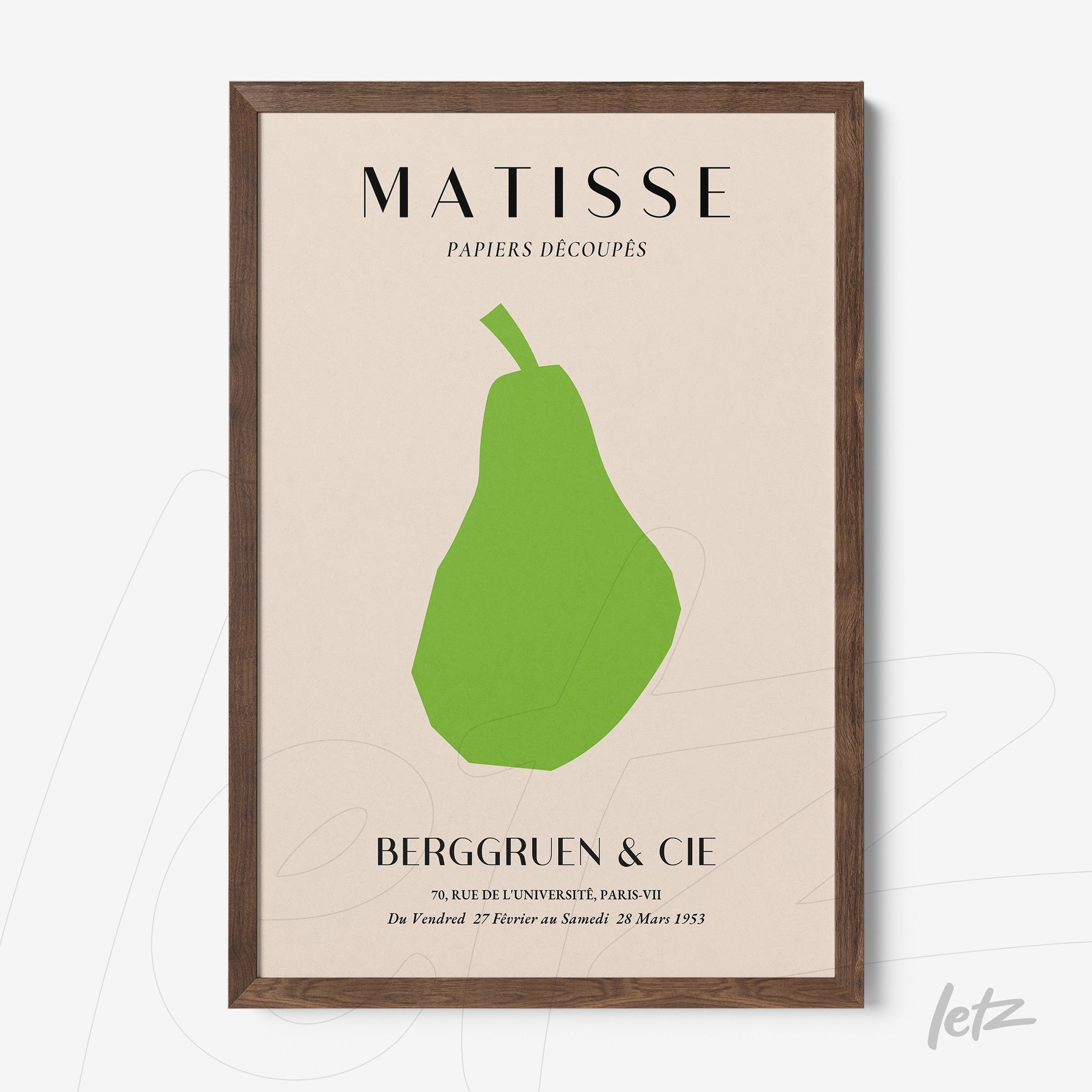 framed contemporary art print of a green pear on beige background with dark wood frame