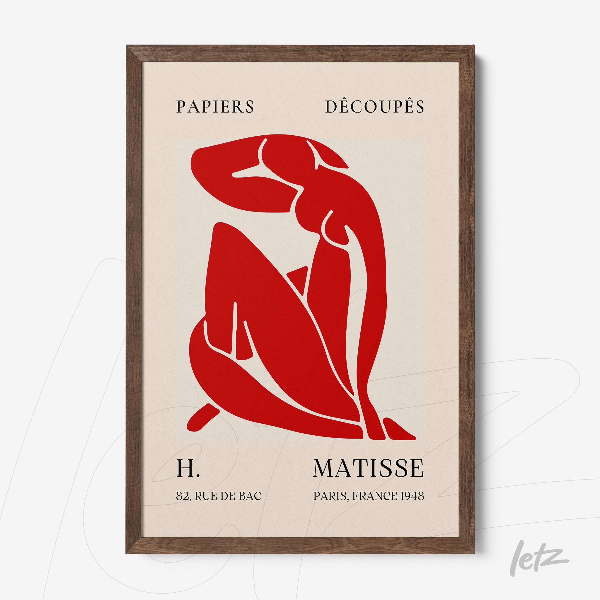 framed art in red inspired by Matisse featuring a seated female figure on cream background with dark wood frame