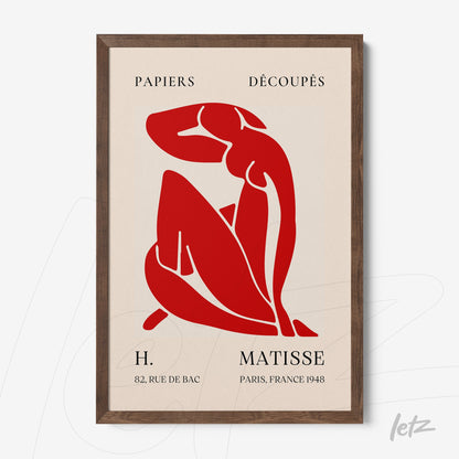 framed art in red inspired by Matisse featuring a seated female figure on cream background with dark wood frame