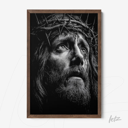 framed black and white portrait of a figure with a crown of thorns in a dark wood frame