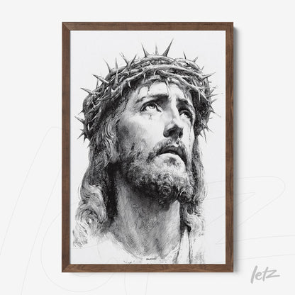 framed artwork of a black and white portrait of Jesus Christ with a crown of thorns in a dark wood frame