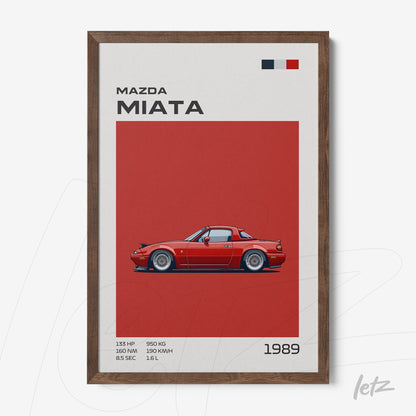 framed artwork featuring a sports car illustration of the Mazda Miata on a red background, with performance details and the year 1989, dark brown frame