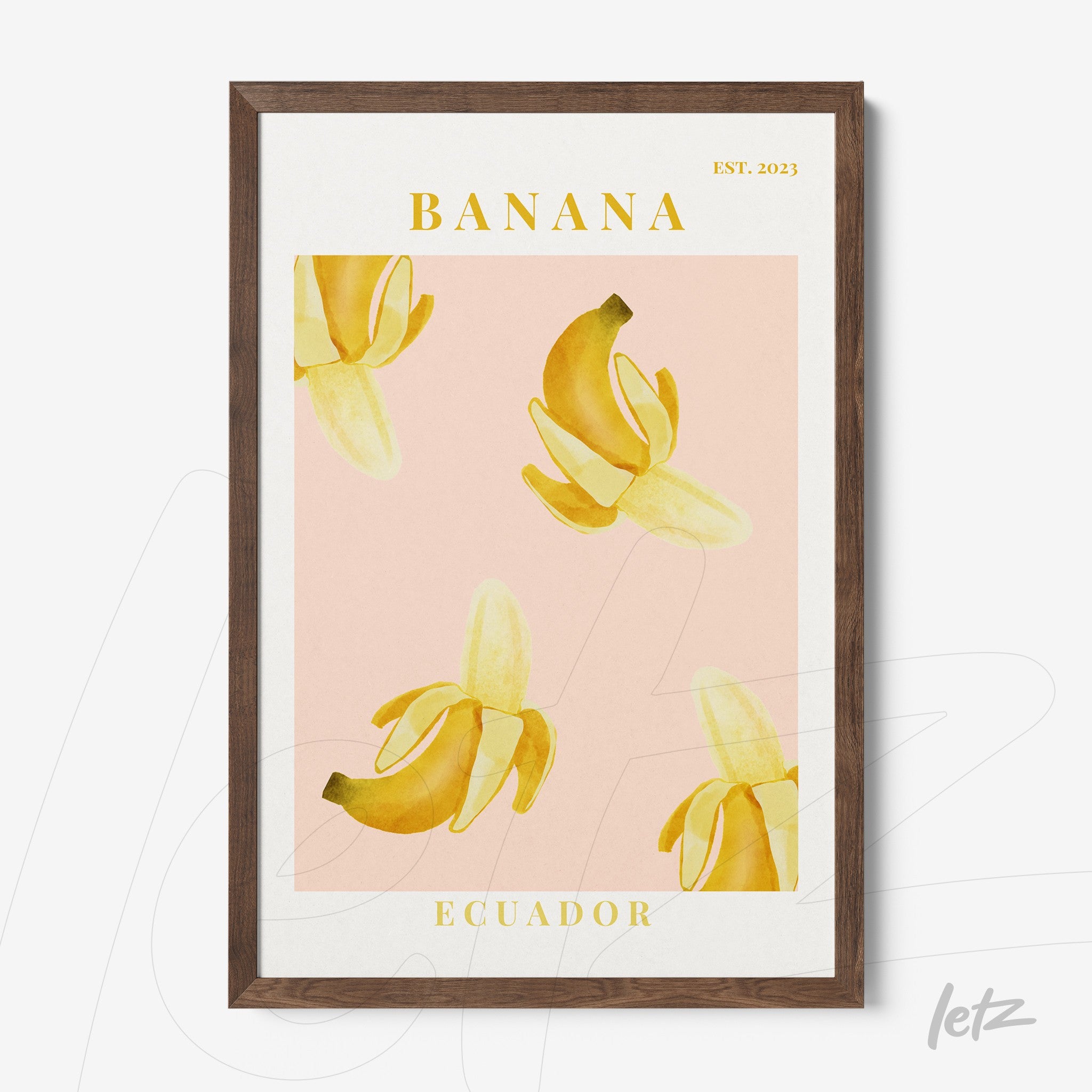 modern wall art featuring bananas on a pink background with dark brown frame