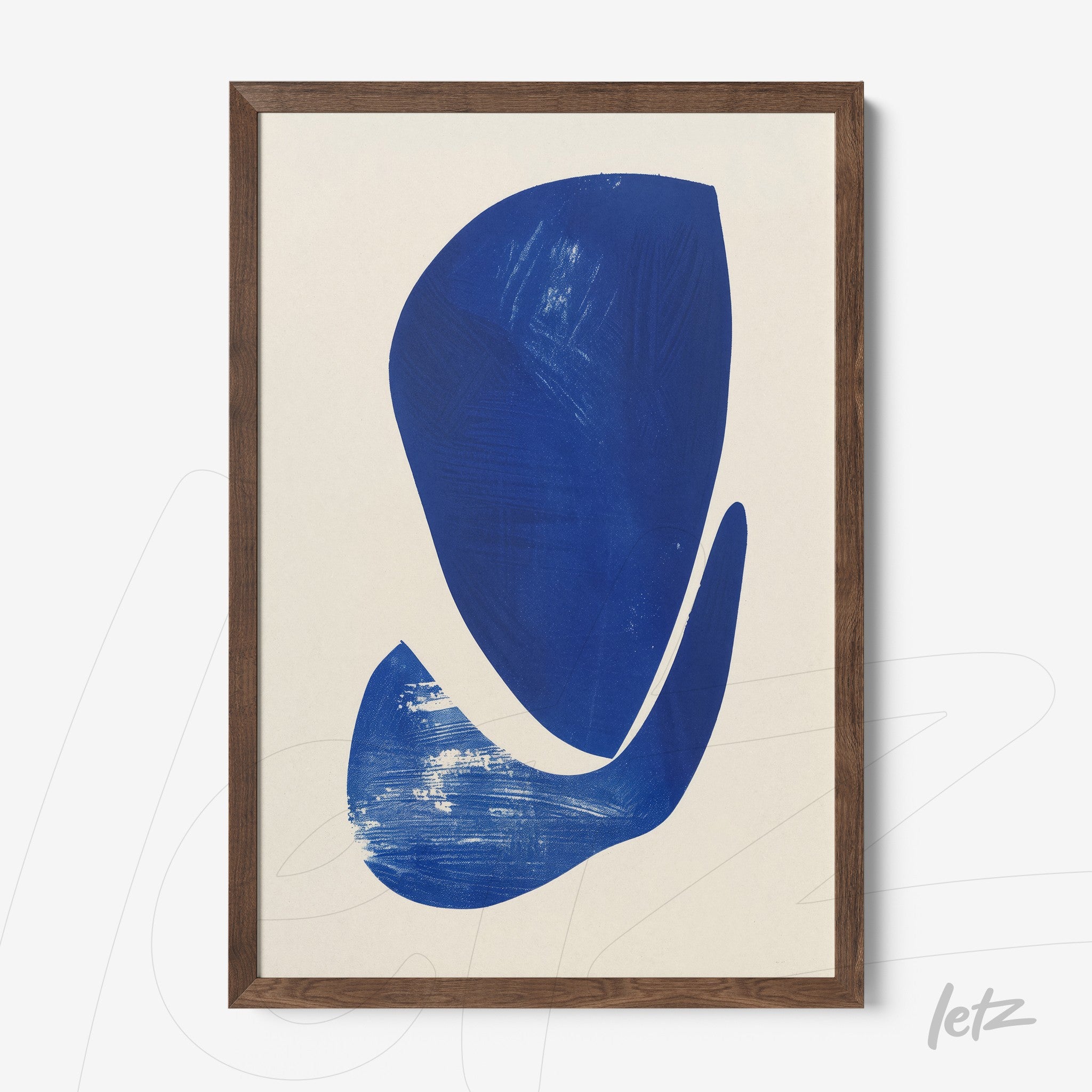 framed artwork featuring abstract blue shapes on light background with dark wood frame