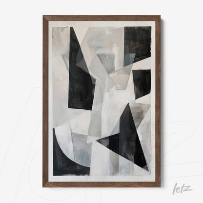 abstract wall art in black and white framed in dark wood
