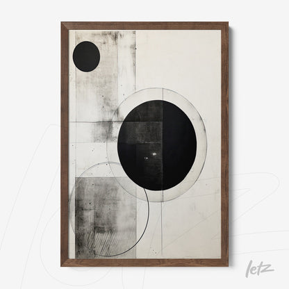 framed abstract wall art in black and white featuring circles and geometric shapes with light wood frame