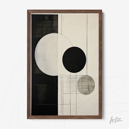 abstract wall art featuring black and white circles with a dark wood frame