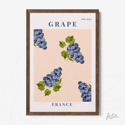 framed wall art featuring blue grapes illustrations on pink background with dark wood frame