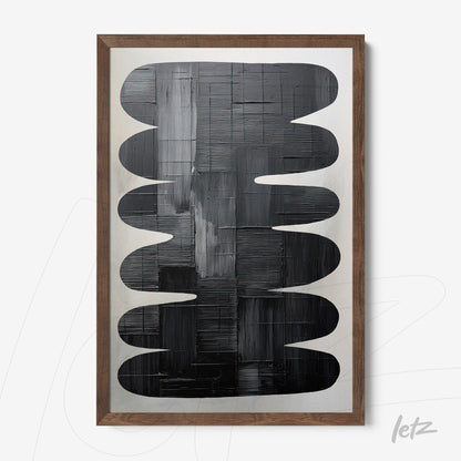 abstract art piece in black tones featuring organic shapes in light wood frame