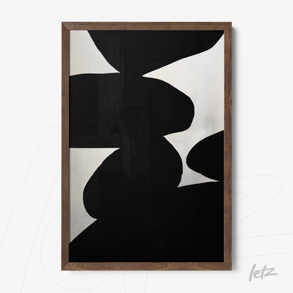 modern wall art featuring abstract shapes in black and white with a dark wood frame