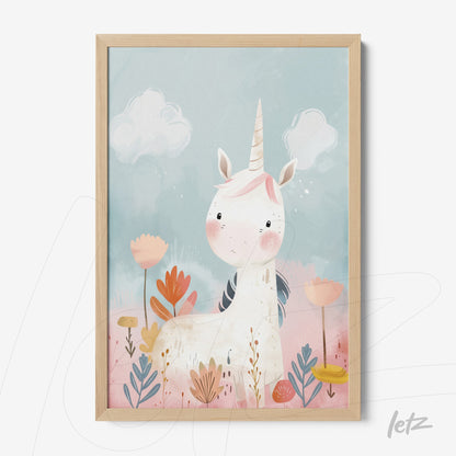 framed children's art of a unicorn with light wood frame against a blue and pink background