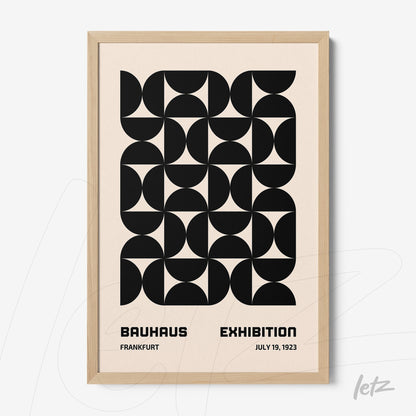 poster with black geometric design on beige background and light wood frame
