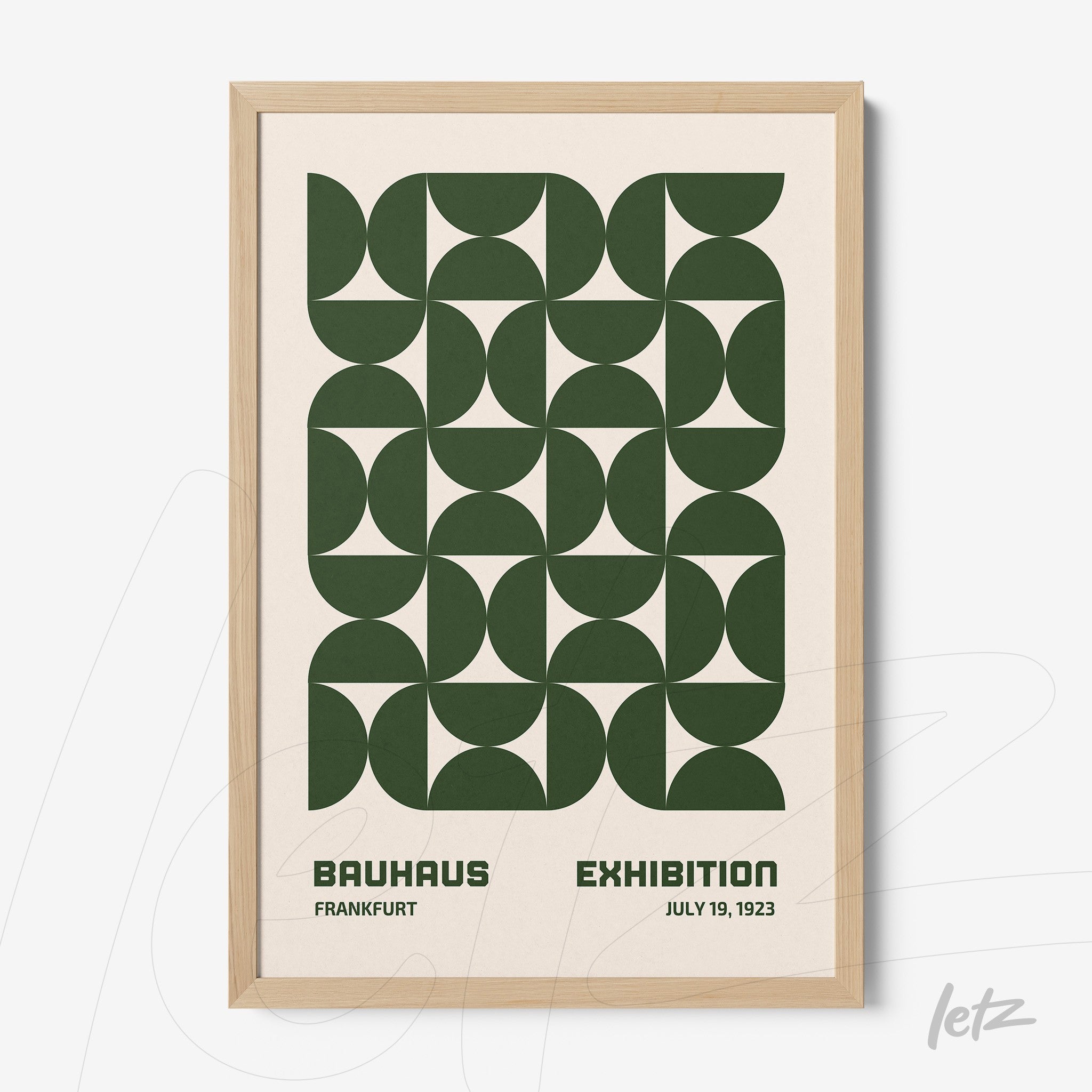 poster featuring green geometric design in light wooden frame