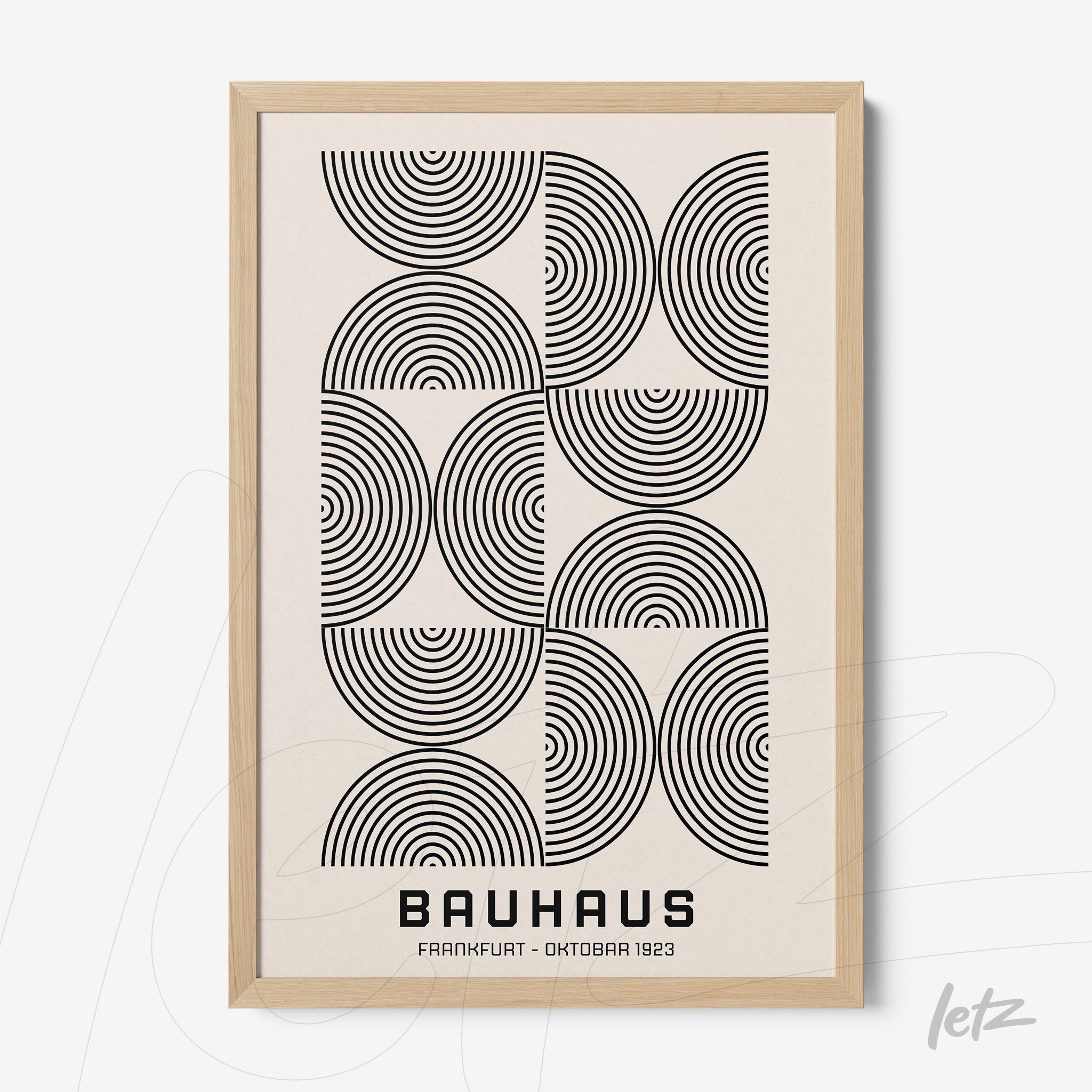 minimalist bauhaus style geometric poster with concentric circles in light wood frame