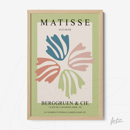 decorative wall art inspired by Matisse in light wood frame featuring organic shapes in blue, pink, and green on cream background