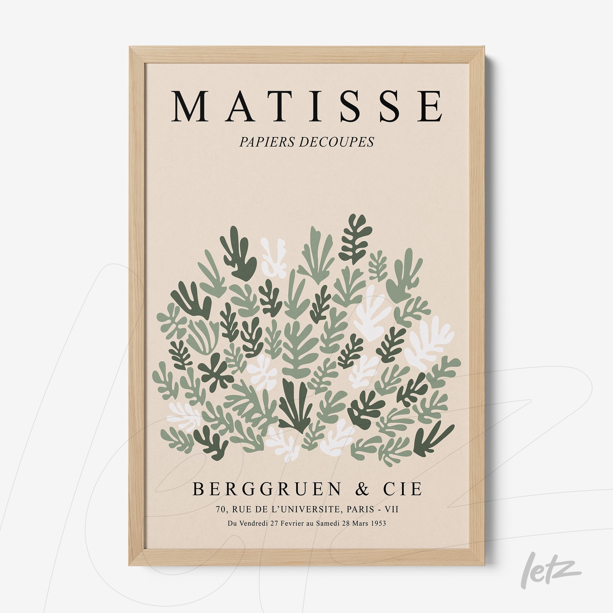 framed art featuring stylized leaves in light wood frame against a neutral background