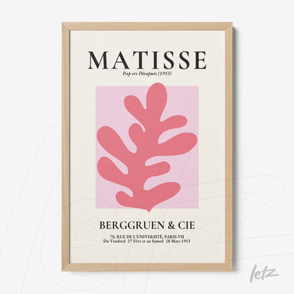 framed art inspired by Matisse featuring a pink leaf against a light pink background with a light wood frame