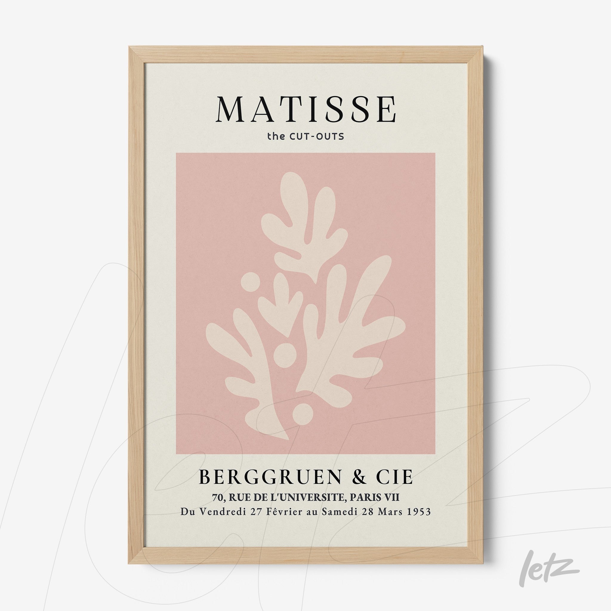 framed modern art inspired by Matisse featuring pink background with white shapes in light wood frame