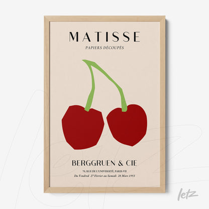 framed wall art featuring minimalist design of red cherries on neutral background