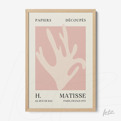 framed modern art featuring a stylized hand on a pink background