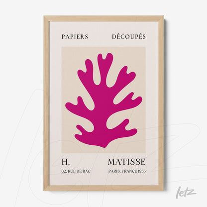 decorative wall art featuring a pink coral shape on a neutral background, framed in light wood