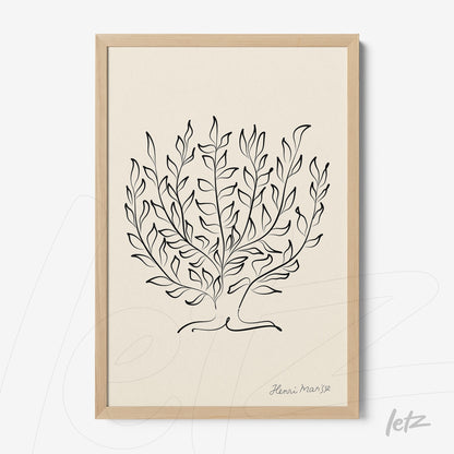 framed artwork featuring minimalist black line drawings of foliage with light wood frame