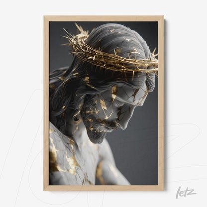 framed wall art featuring a sculpture of Christ adorned with golden leaves against a dark background
