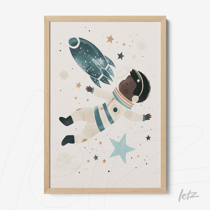 framed artwork of an astronaut floating in space with a light wood frame
