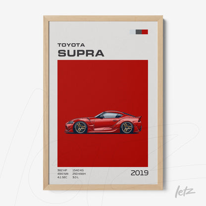 framed wall art featuring a sports car Toyota Supra in red background and light wood frame