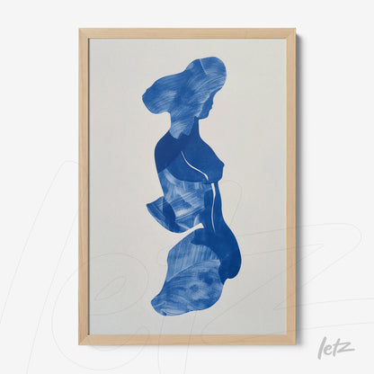 framed abstract art in blue tones depicting a female silhouette with a light wooden frame