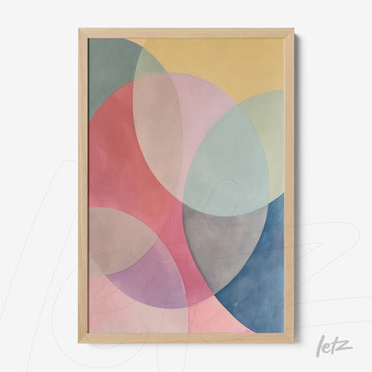 framed artwork featuring abstract geometric shapes in pastel colors with a light wood frame
