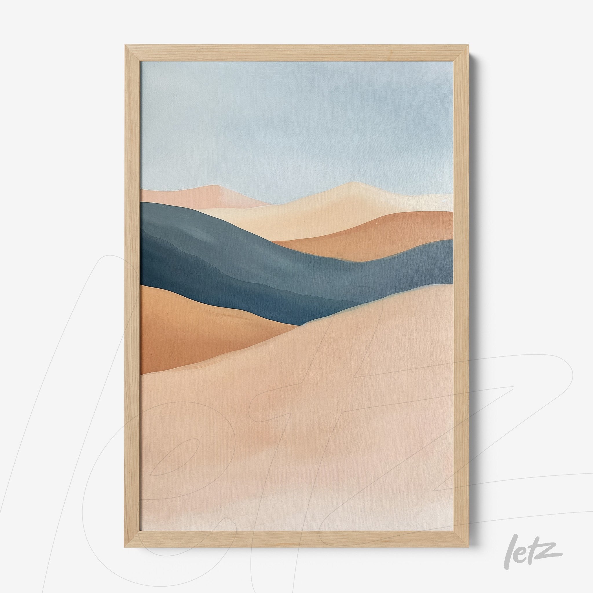 framed abstract art piece in earthy tones and blues with light wood frame
