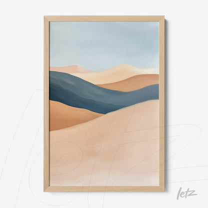 framed abstract art piece in earthy tones and blues with light wood frame