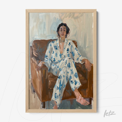 framed figurative portrait of a woman sitting on a brown armchair wearing a white pajama with blue patterns with a light wood frame
