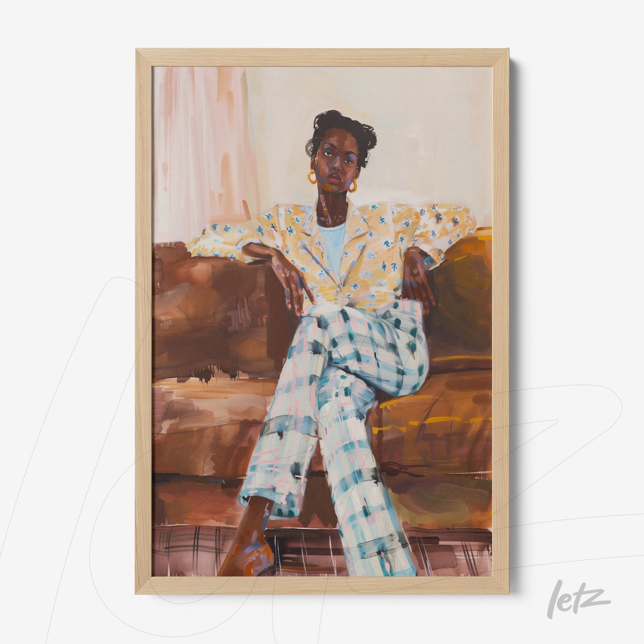 framed artwork depicting a seated Black woman in a floral blazer and plaid trousers on a sofa with a light wood frame